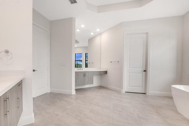8660 W Parkland Bay Trl, Parkland, FL 33076 - full bath featuring a soaking tub, vanity, baseboards, and recessed lighting