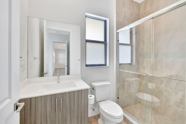 8660 W Parkland Bay Trl, Parkland, FL 33076 - bathroom featuring toilet, vanity, and a shower stall