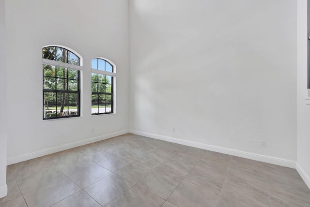 8660 W Parkland Bay Trl, Parkland, FL 33076 - spare room with baseboards and light tile patterned floors