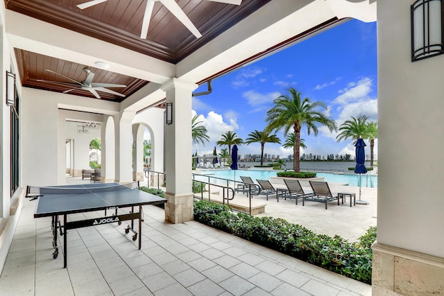 8660 W Parkland Bay Trl, Parkland, FL 33076 - view of patio / terrace with ceiling fan and a community pool