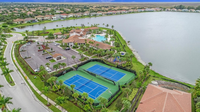 8660 W Parkland Bay Trl, Parkland, FL 33076 - aerial view of residential area with a large body of water and a pool area