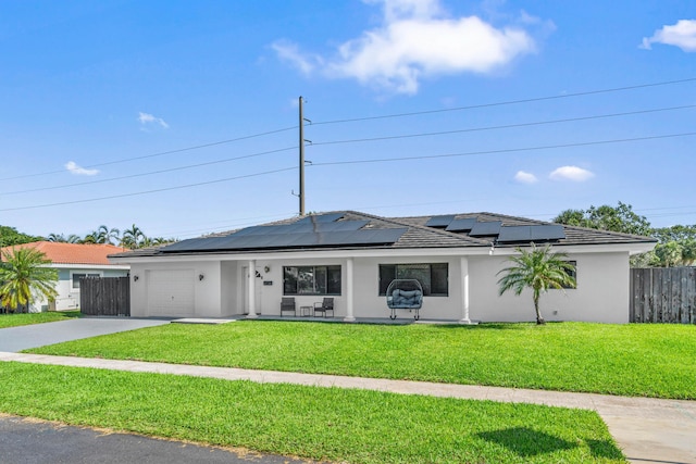 977 W Royal Palm Rd, Boca Raton, FL 33486 - view of front of property with a garage, driveway, stucco siding, and solar panels