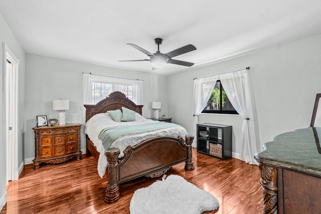 977 W Royal Palm Rd, Boca Raton, FL 33486 - bedroom with wood finished floors, baseboards, and a ceiling fan