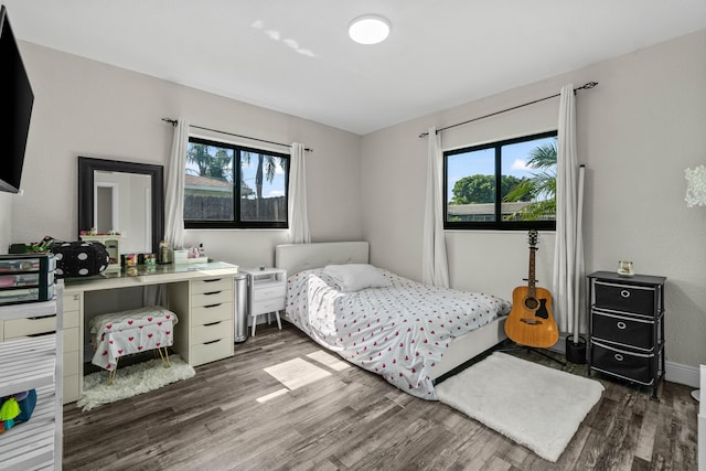 977 W Royal Palm Rd, Boca Raton, FL 33486 - bedroom with multiple windows, dark wood-style floors, and baseboards