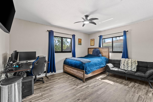 977 W Royal Palm Rd, Boca Raton, FL 33486 - bedroom featuring multiple windows, wood finished floors, an office area, and a ceiling fan