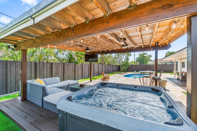 977 W Royal Palm Rd, Boca Raton, FL 33486 - wooden deck with a hot tub, a fenced backyard, and an outdoor living space