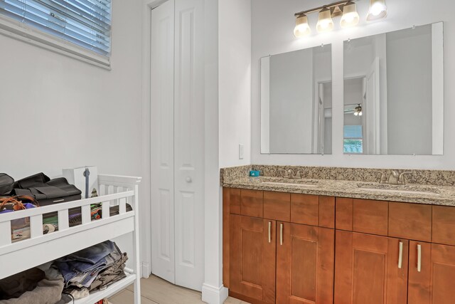 309 NE 11th Ave, Boynton Beach, FL 33435 - full bath with a closet, double vanity, and ceiling fan