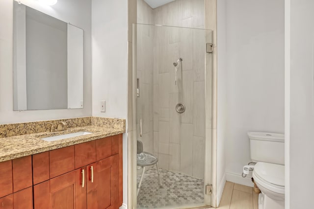 309 NE 11th Ave, Boynton Beach, FL 33435 - bathroom with a stall shower, toilet, vanity, and tile patterned flooring
