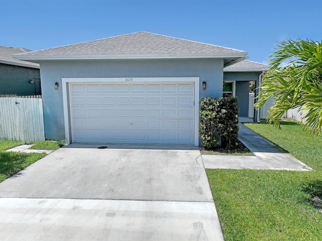 309 NE 11th Ave, Boynton Beach, FL 33435 - ranch-style house featuring concrete driveway, stucco siding, roof with shingles, and a garage