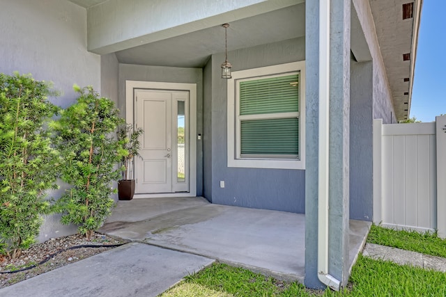 309 NE 11th Ave, Boynton Beach, FL 33435 - doorway to property featuring stucco siding
