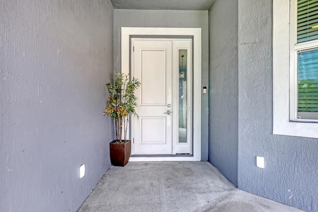 309 NE 11th Ave, Boynton Beach, FL 33435 - view of exterior entry featuring stucco siding