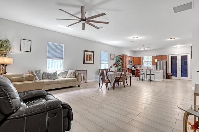 309 NE 11th Ave, Boynton Beach, FL 33435 - living room with ceiling fan and baseboards