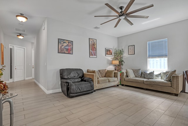 309 NE 11th Ave, Boynton Beach, FL 33435 - living room with ceiling fan, light wood-style floors, and baseboards
