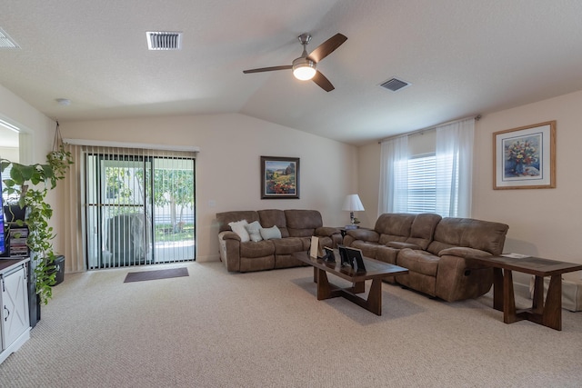 29 Mediterranean Blvd W, Port Saint Lucie, FL 34952 - carpeted living room with lofted ceiling and a ceiling fan
