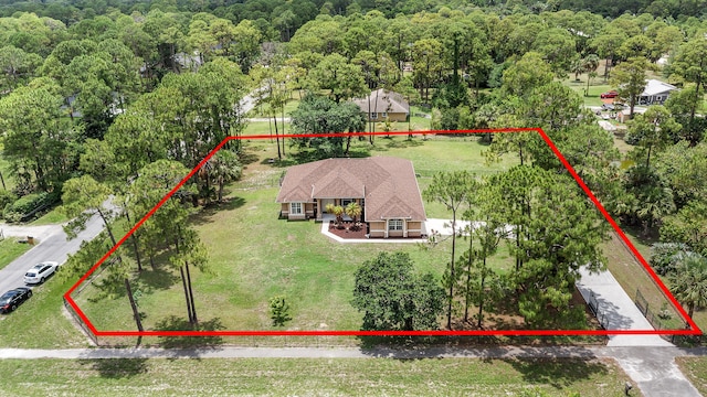6839 Banyan Blvd, The Acreage, FL 33470 - aerial view of property and surrounding area with property boundaries highlighted and a forest
