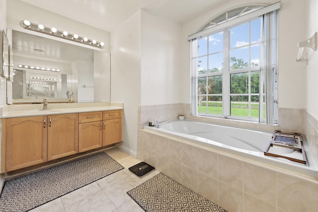 6839 Banyan Blvd, The Acreage, FL 33470 - full bath featuring vanity, a garden tub, and tile patterned flooring