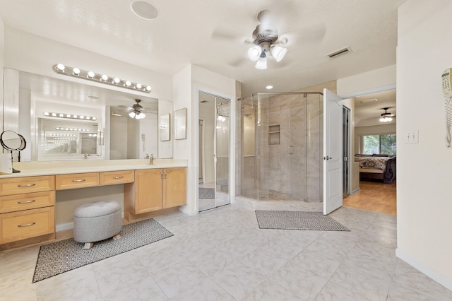 6839 Banyan Blvd, The Acreage, FL 33470 - ensuite bathroom featuring ceiling fan, a stall shower, vanity, and baseboards
