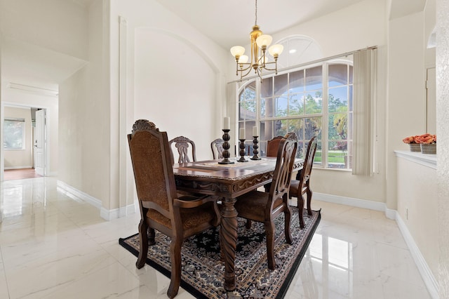 6839 Banyan Blvd, The Acreage, FL 33470 - dining area with a chandelier, light marble finish floors, and baseboards