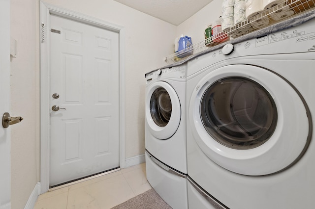 6839 Banyan Blvd, The Acreage, FL 33470 - laundry room featuring baseboards and washing machine and dryer
