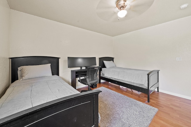 6839 Banyan Blvd, The Acreage, FL 33470 - bedroom with wood finished floors, baseboards, and a ceiling fan