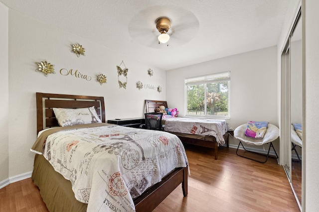 6839 Banyan Blvd, The Acreage, FL 33470 - bedroom featuring wood finished floors, ceiling fan, and baseboards