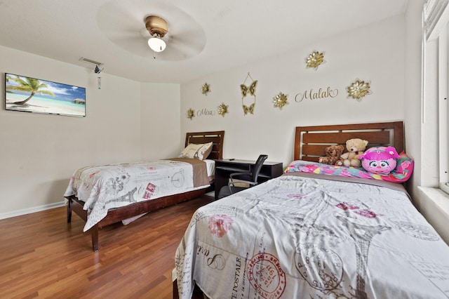 6839 Banyan Blvd, The Acreage, FL 33470 - bedroom featuring wood finished floors, baseboards, and a ceiling fan
