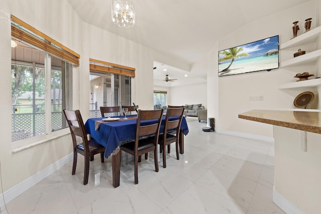 6839 Banyan Blvd, The Acreage, FL 33470 - dining space featuring marble finish flooring, baseboards, ceiling fan, a chandelier, and vaulted ceiling