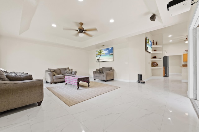 6839 Banyan Blvd, The Acreage, FL 33470 - living room with ceiling fan, light marble finish floors, a tray ceiling, recessed lighting, and baseboards