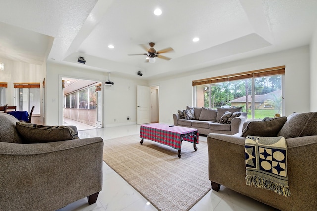 6839 Banyan Blvd, The Acreage, FL 33470 - living room featuring a tray ceiling, ceiling fan, and recessed lighting