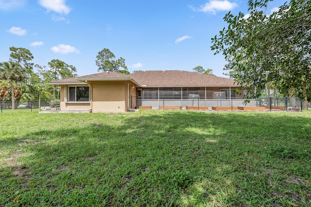 6839 Banyan Blvd, The Acreage, FL 33470 - rear view of property featuring stucco siding and a sunroom