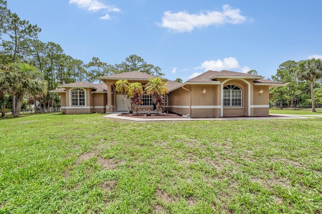 6839 Banyan Blvd, The Acreage, FL 33470 - view of front facade with stucco siding