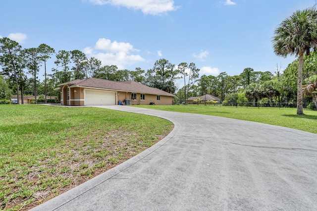 6839 Banyan Blvd, The Acreage, FL 33470 - view of front facade with driveway, an attached garage, and stucco siding