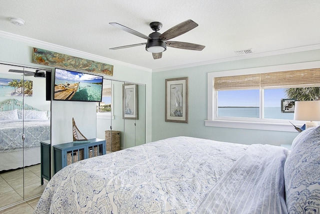 1177 Bayshore Dr Unit 207, Fort Pierce, FL 34949 - tiled bedroom with ornamental molding and ceiling fan