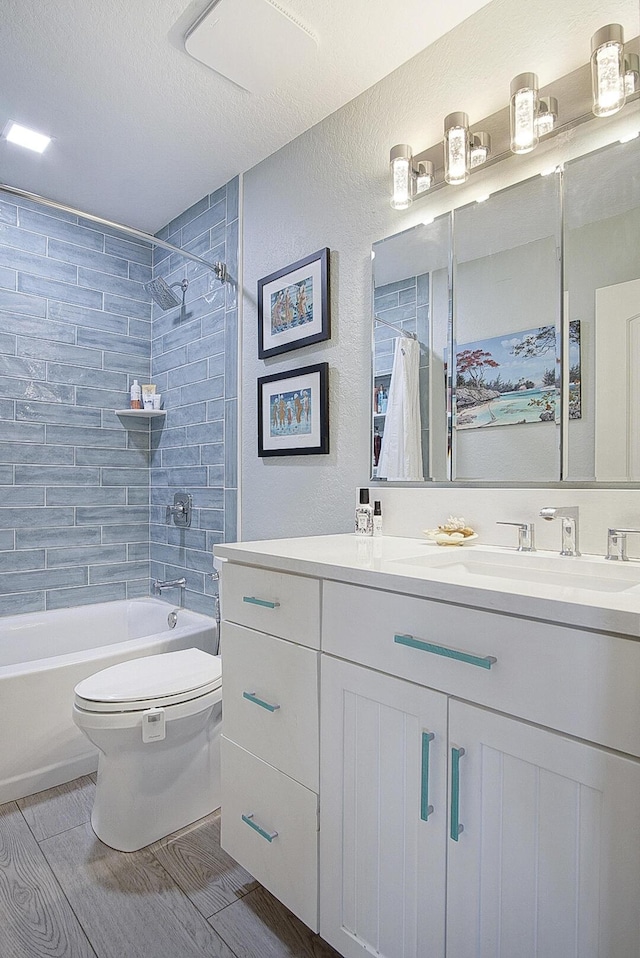 1177 Bayshore Dr Unit 207, Fort Pierce, FL 34949 - full bathroom with toilet, vanity, shower / bath combo with shower curtain, a textured wall, and a textured ceiling