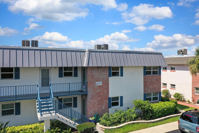1177 Bayshore Dr Unit 207, Fort Pierce, FL 34949 - view of property featuring stairway and central air condition unit