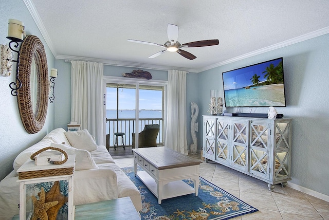 1177 Bayshore Dr Unit 207, Fort Pierce, FL 34949 - living area with ceiling fan, crown molding, a textured ceiling, tile patterned flooring, and baseboards
