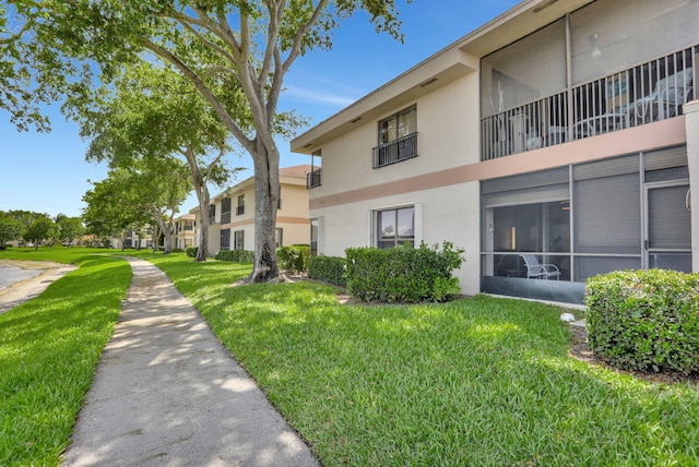 2850 Carambola Cir S Unit 19121, Coconut Creek, FL 33066 - view of property's community with a lawn
