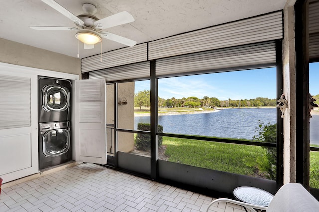 2850 Carambola Cir S Unit 19121, Coconut Creek, FL 33066 - sunroom featuring stacked washing machine and dryer, a water view, and ceiling fan