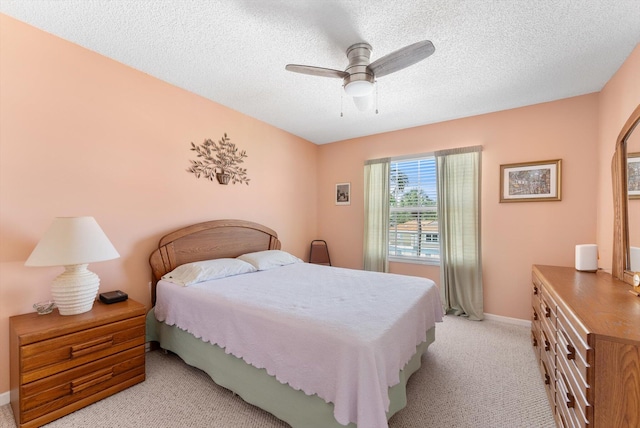 7930 Nolting Ct, Lake Worth, FL 33467 - bedroom featuring light carpet, a textured ceiling, ceiling fan, and baseboards