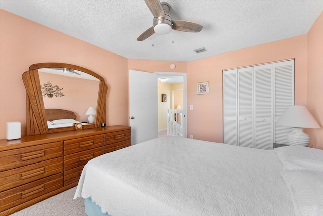 7930 Nolting Ct, Lake Worth, FL 33467 - carpeted bedroom featuring ceiling fan, a closet, and a textured ceiling