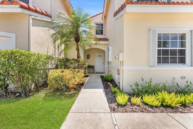 7930 Nolting Ct, Lake Worth, FL 33467 - entrance to property with a tile roof and stucco siding