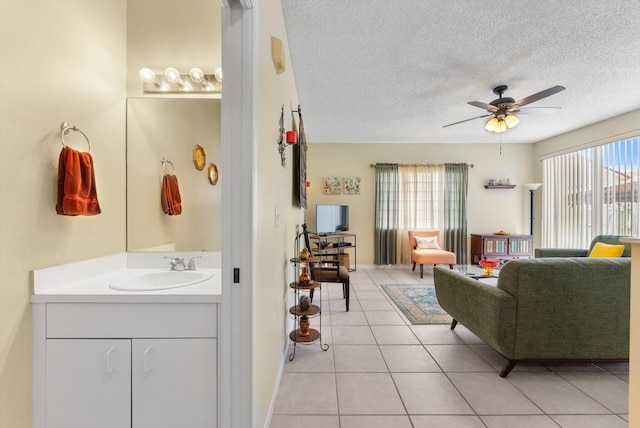7930 Nolting Ct, Lake Worth, FL 33467 - living area with ceiling fan, light tile patterned floors, and a textured ceiling