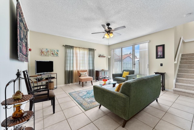 7930 Nolting Ct, Lake Worth, FL 33467 - living area featuring stairway, a ceiling fan, light tile patterned floors, a textured ceiling, and baseboards