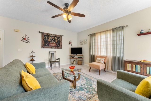7930 Nolting Ct, Lake Worth, FL 33467 - living area with tile patterned floors, a ceiling fan, a textured ceiling, and baseboards