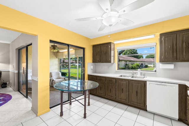 4731 Storkwood Ln Unit A, Boynton Beach, FL 33436 - kitchen featuring white dishwasher, a sink, dark brown cabinetry, and light countertops