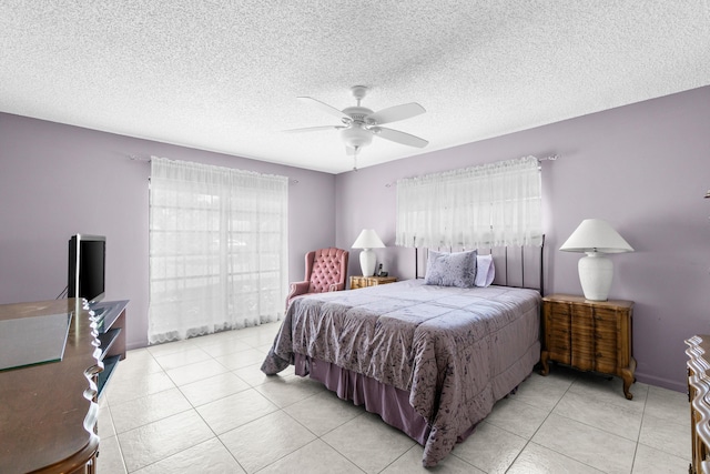 4731 Storkwood Ln Unit A, Boynton Beach, FL 33436 - bedroom with light tile patterned floors, a ceiling fan, and a textured ceiling