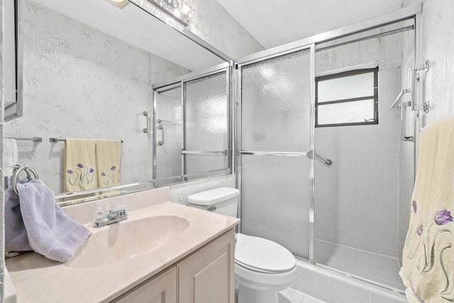 4731 Storkwood Ln Unit A, Boynton Beach, FL 33436 - bathroom with toilet, a shower stall, vanity, and wallpapered walls