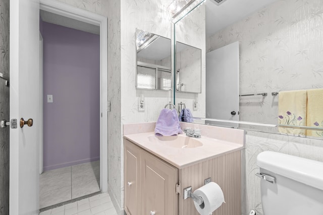 4731 Storkwood Ln Unit A, Boynton Beach, FL 33436 - bathroom with wallpapered walls, vanity, toilet, and tile patterned floors