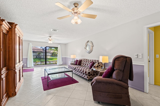 4731 Storkwood Ln Unit A, Boynton Beach, FL 33436 - living room with a textured ceiling, a ceiling fan, and light tile patterned flooring
