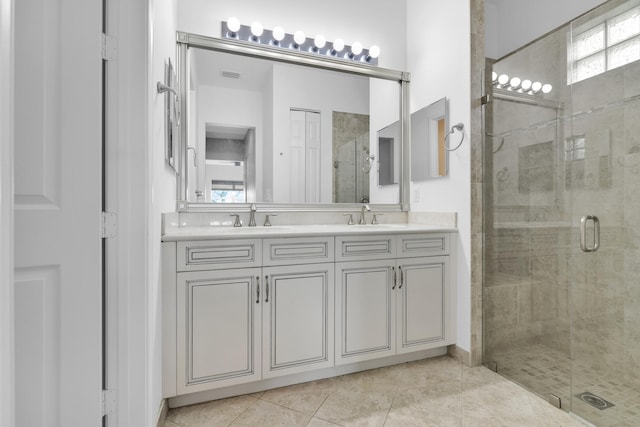 14841 Strand Ln (), Unit Delray Beach, FL 33446 - full bathroom with a stall shower, double vanity, plenty of natural light, and tile patterned floors